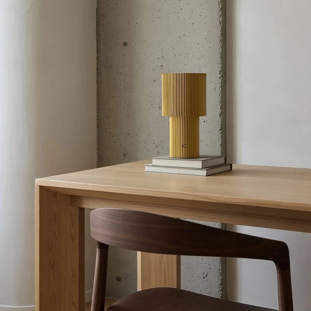 Iluma portable table lamp, Gold Herstal