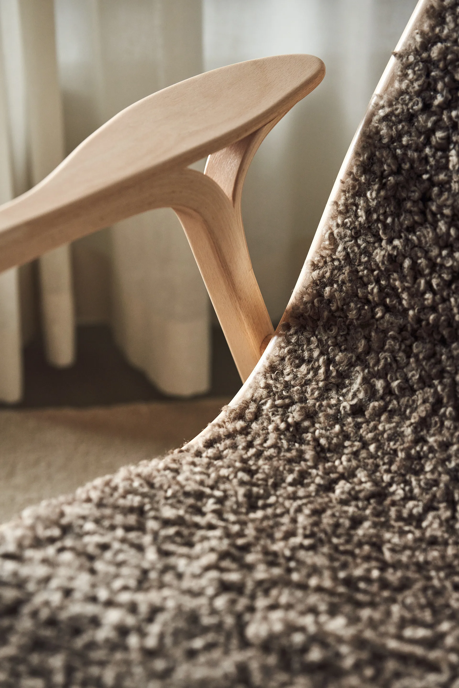 Lamino armchair and footstool varnished beech/sheepskin, Sahara (nougat-brown) Swedese