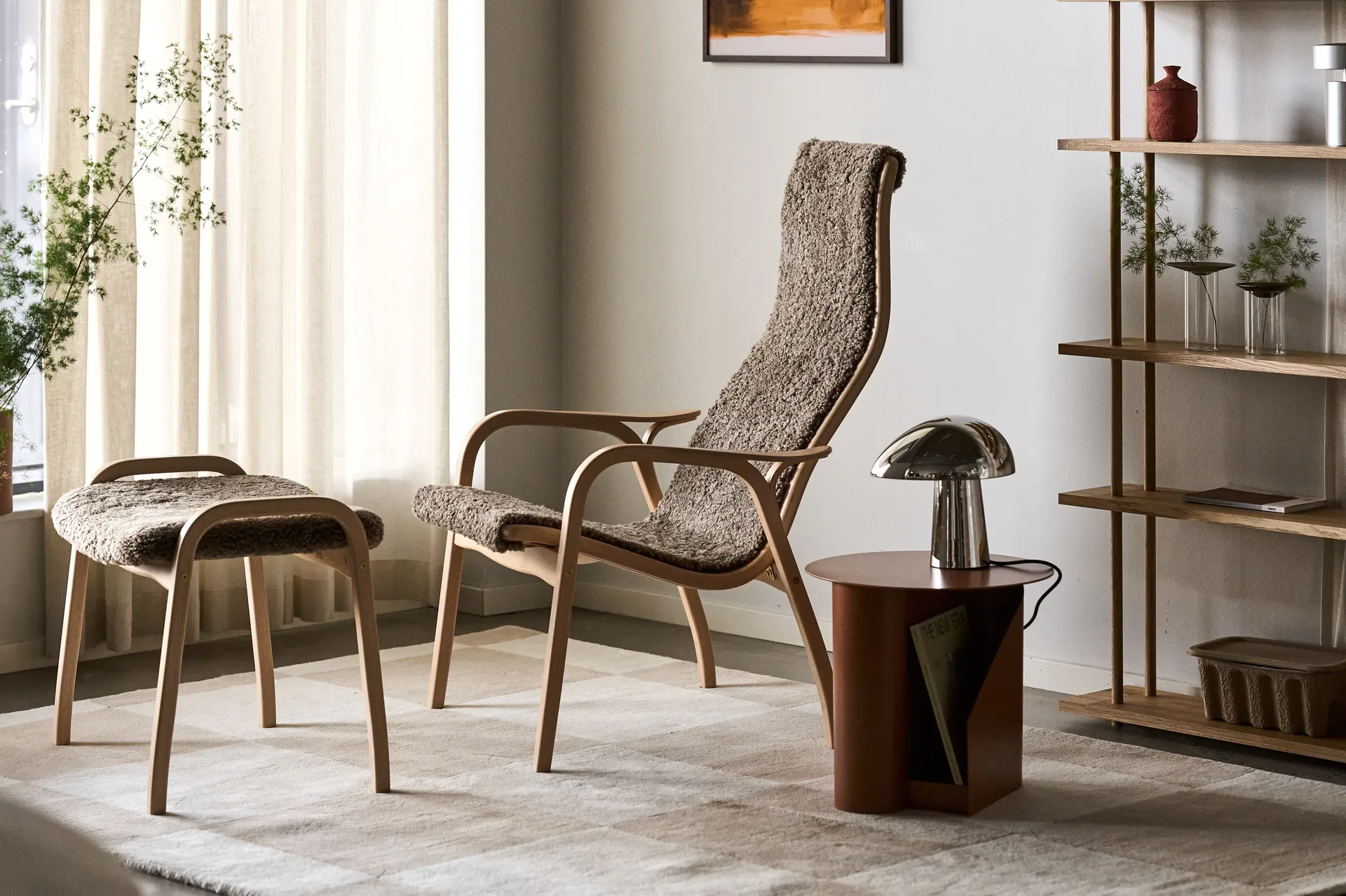 Lamino armchair and footstool varnished beech/sheepskin, Sahara (nougat-brown) Swedese