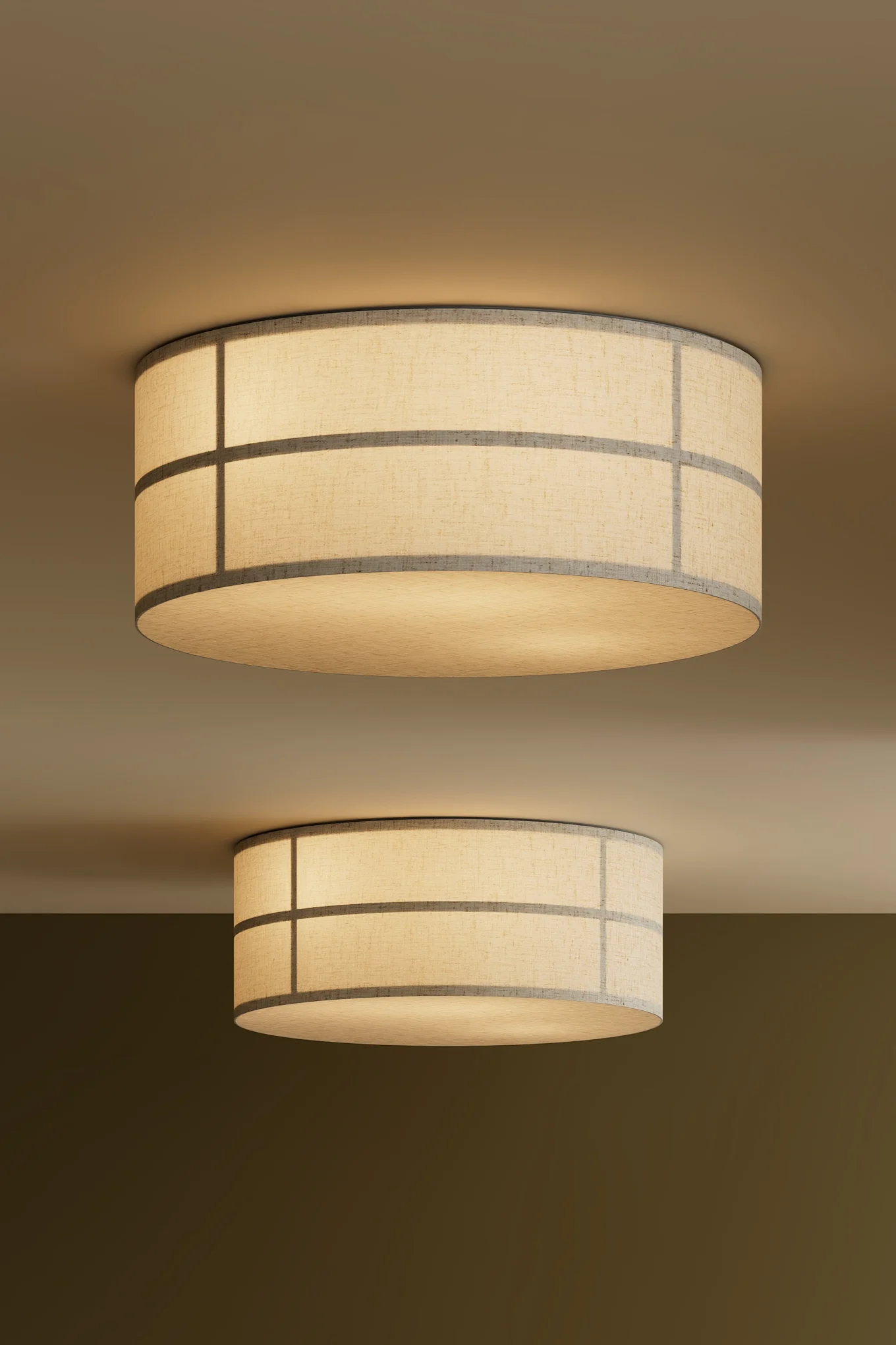 Two drum-shaped ceiling lights with fabric shades and a grid pattern, emitting a warm glow.