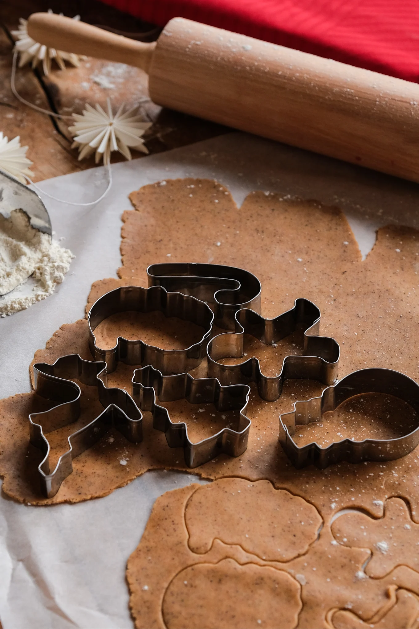 Swedish Christmas baking always includes gingerbread. Here you see the moulds laid out on a gingerbread dough together with a rolling pin.