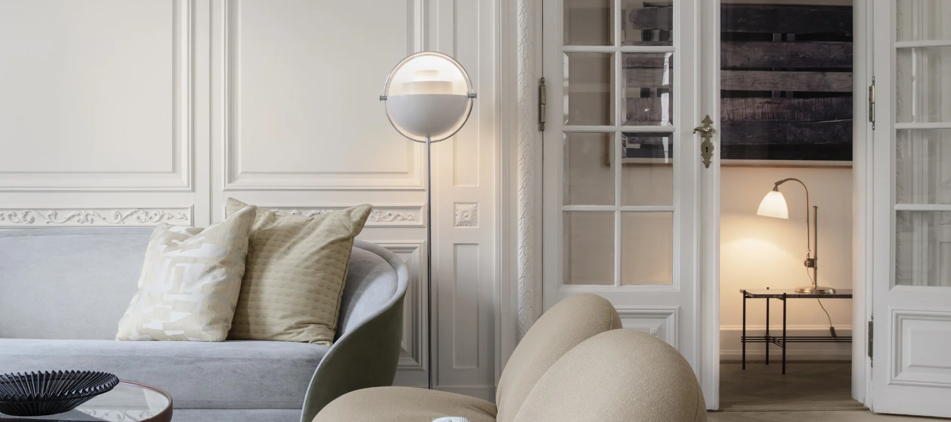 Discover Gubi's top tips for lighting your home, here you see the Multi-Lite floor lamp in white in a white living room.