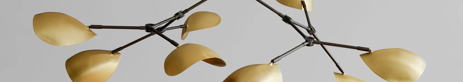 Modern chandelier with dark metal arms and multiple brass leaf-shaped shades against a light background.
