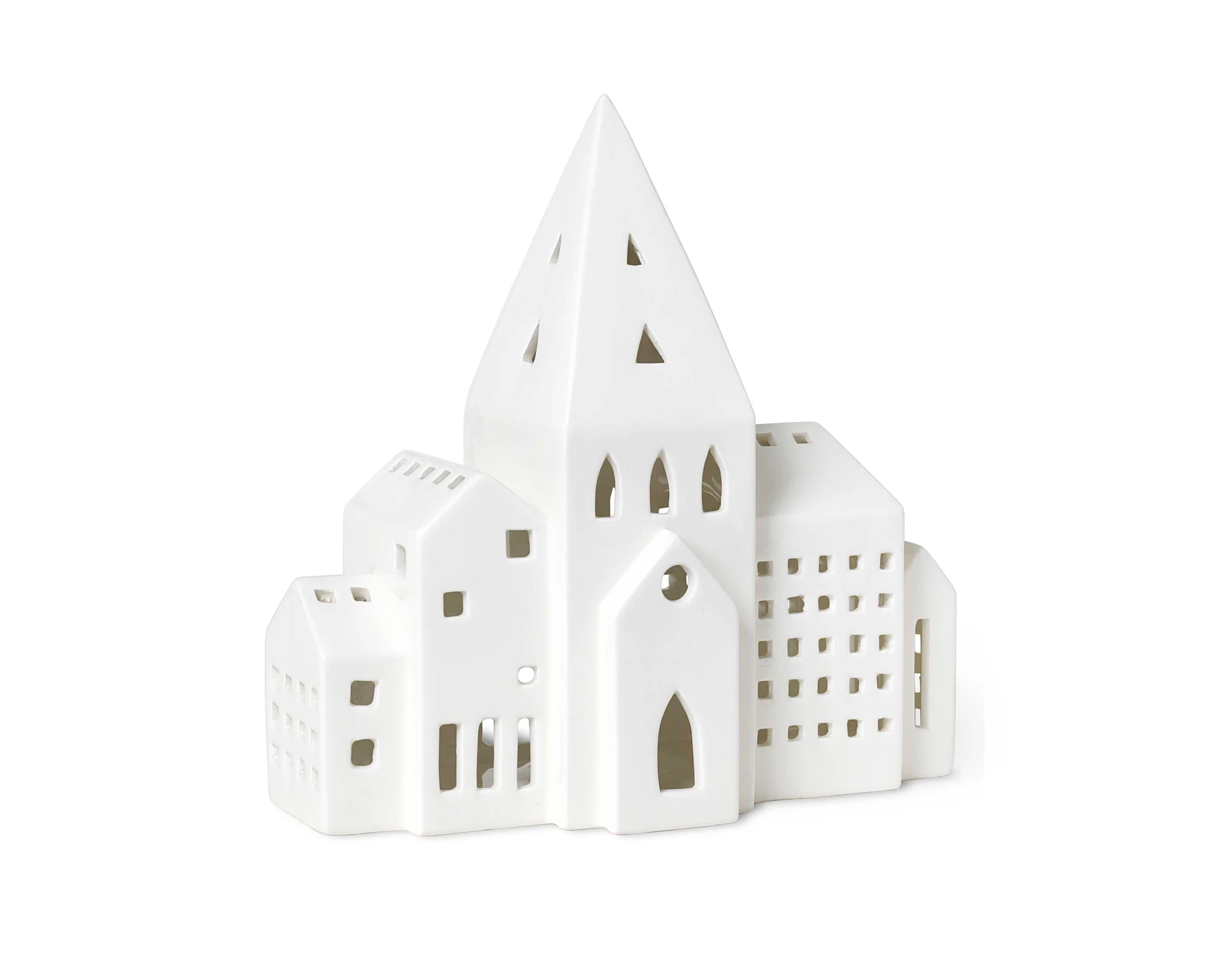 White ceramic house decoration with a tall spire and cut-out windows.