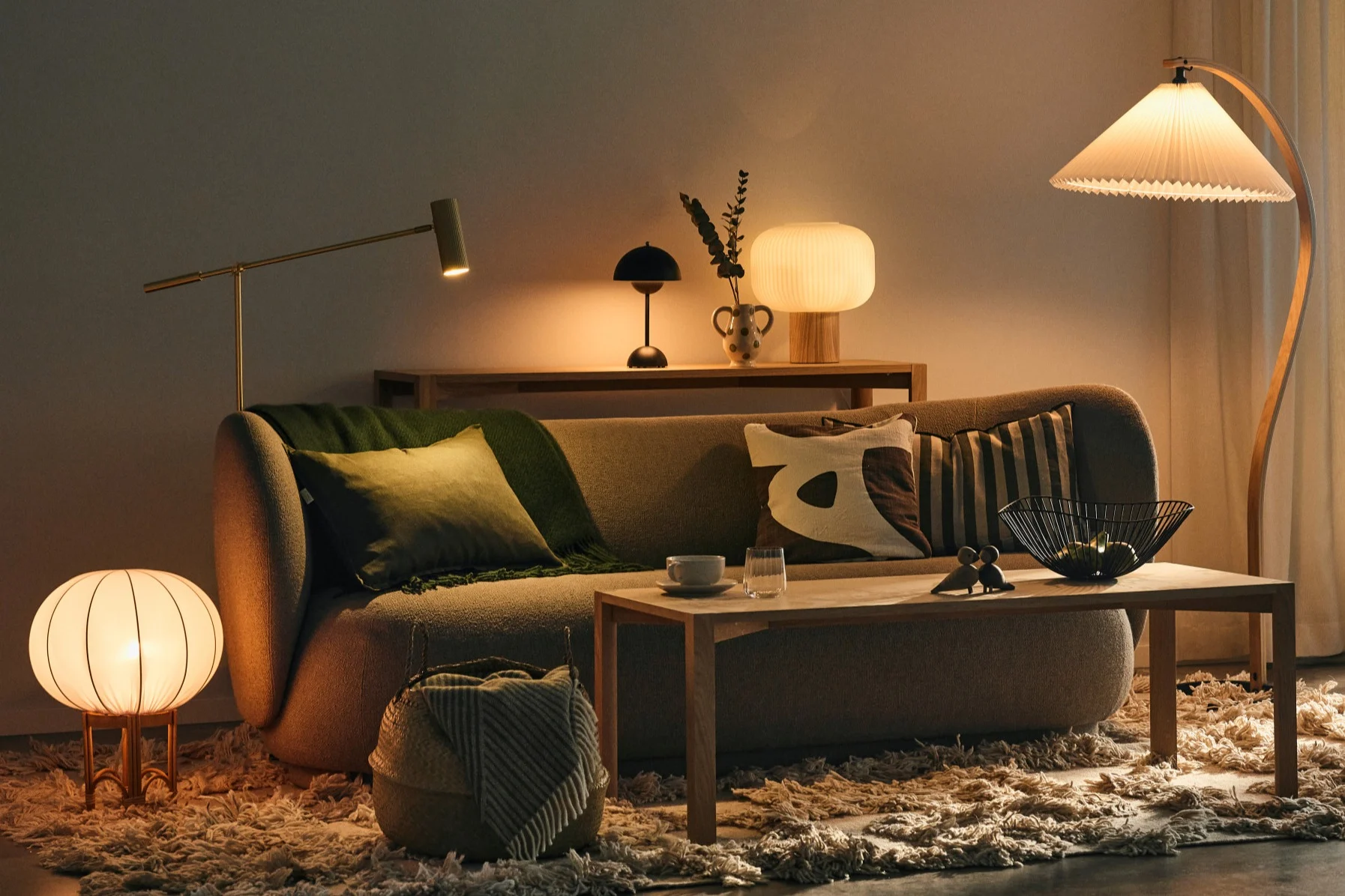 Plan your lighting so you have multiple light sources in one room like this living room with lots of lights with different functions.