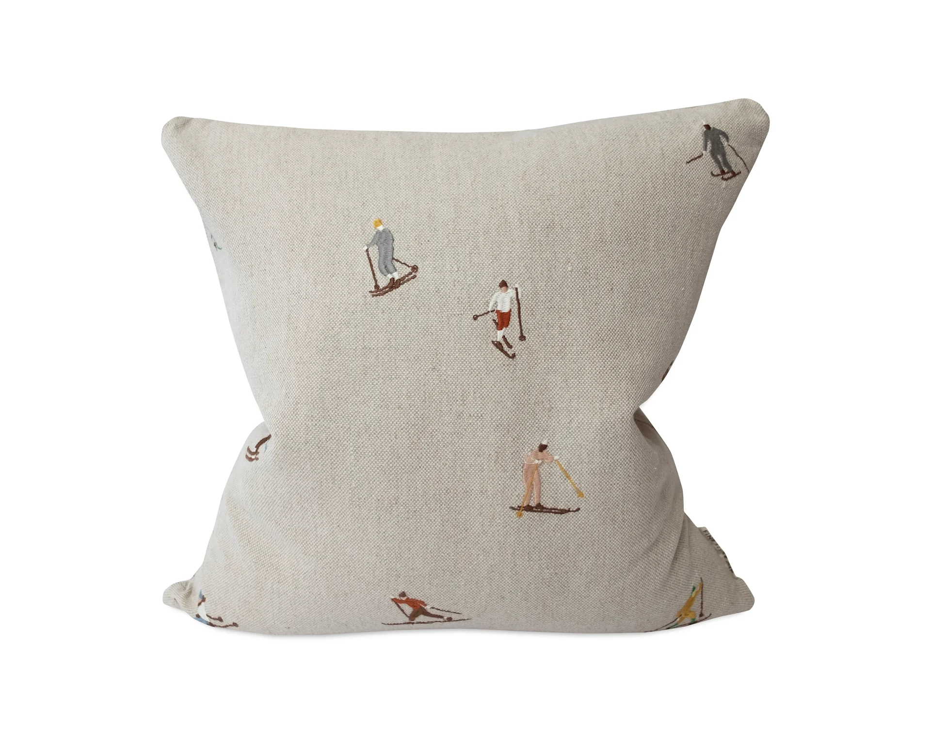 Light beige cushion with embroidered skiers and snowshoers.