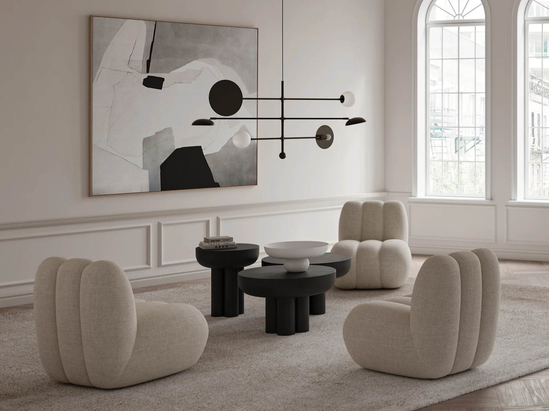 A modern living room with three beige armless chairs, black round coffee tables, a large abstract painting, and a black linear chandelier.