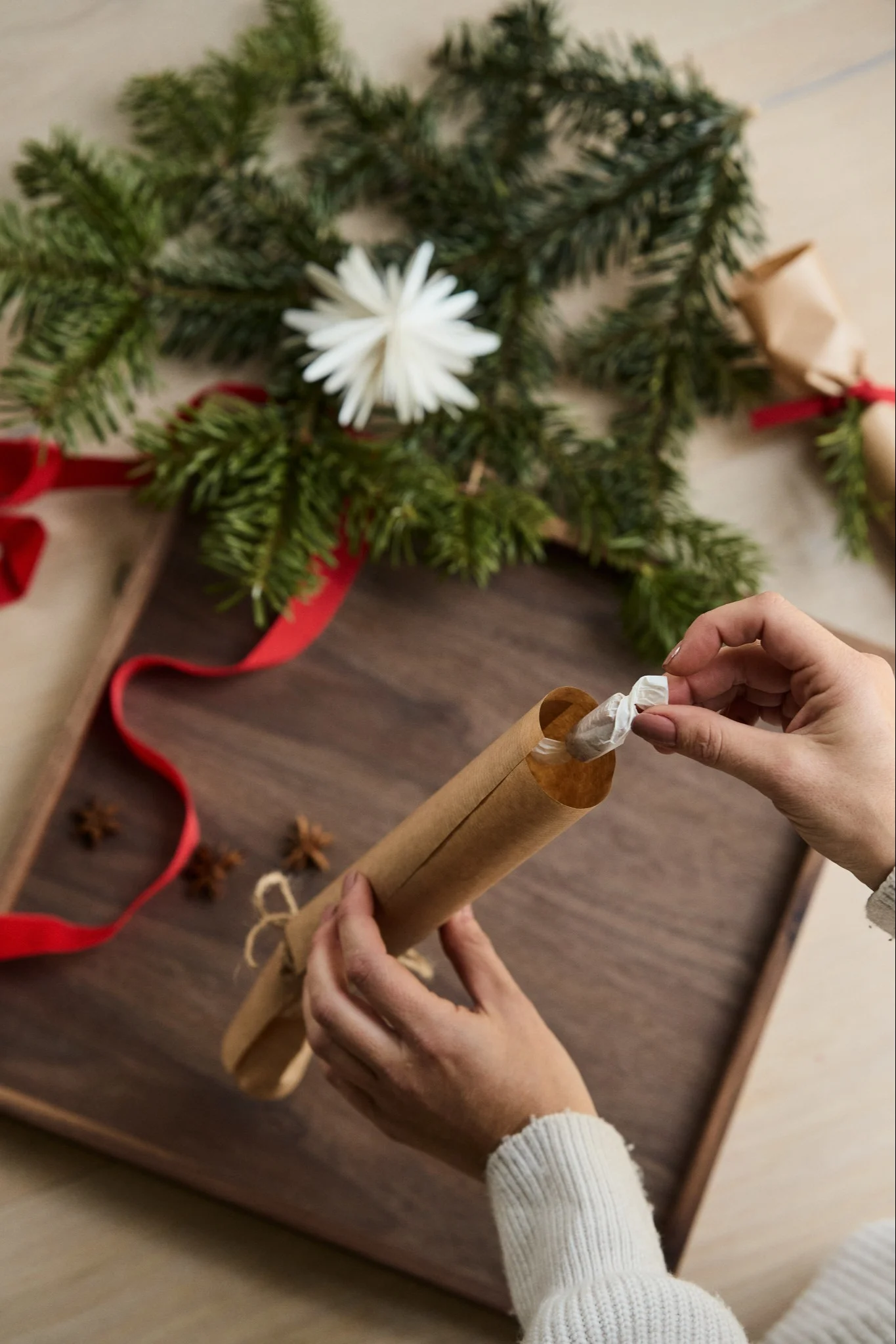 Step 4 in making your own Christmas cracker - add your candy and small gifts to the cracker.