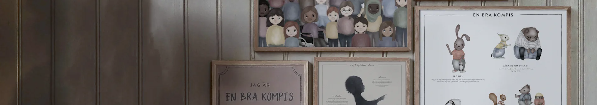 Framed children's posters on a wall, depicting diverse cartoon children, animals showing social skills, and safety tips.