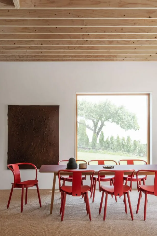Red kitchen chairs from Massproductions show what the red trend could look like in the Scandinavian interior design trends 2024.