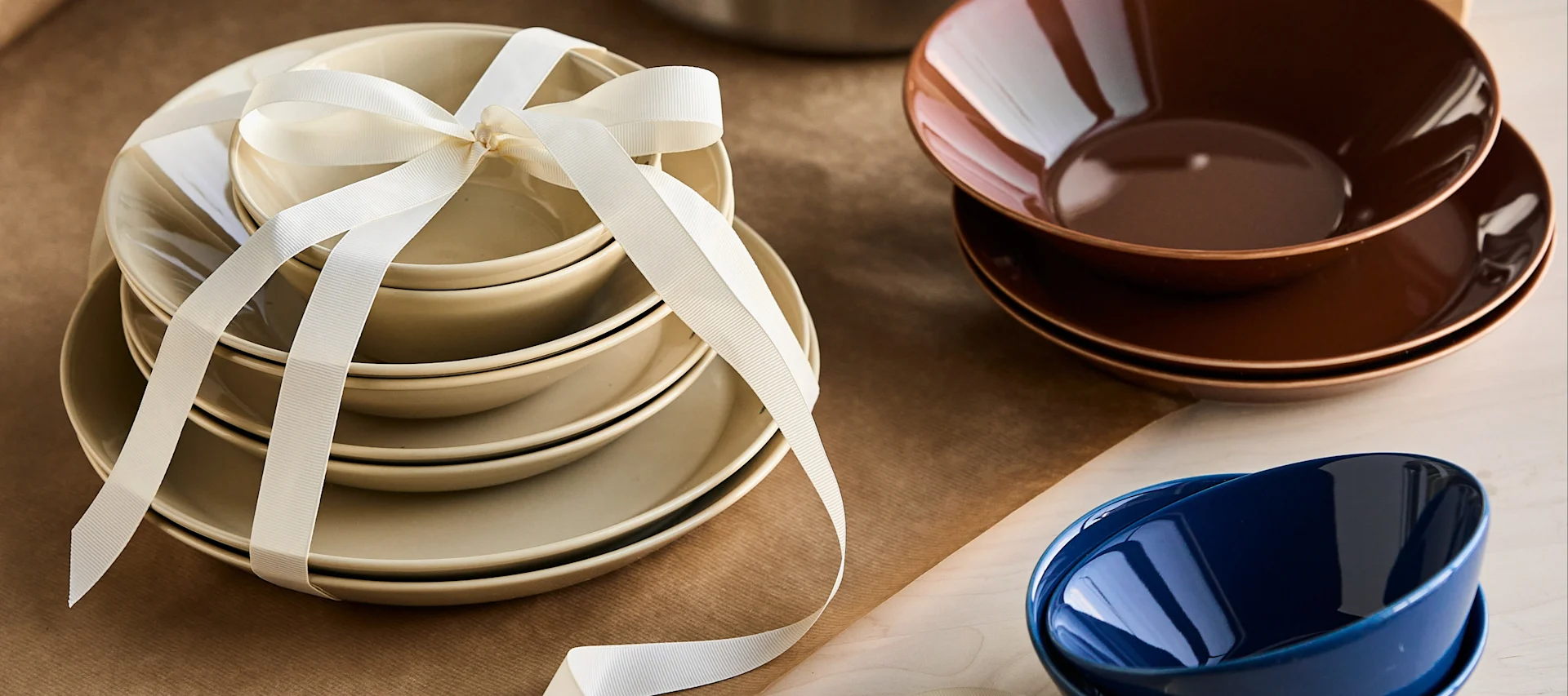 Creative gift ideas for any occasion - here you see a collection of Teema porcelain wrapped in a bow ready to give as a gift.