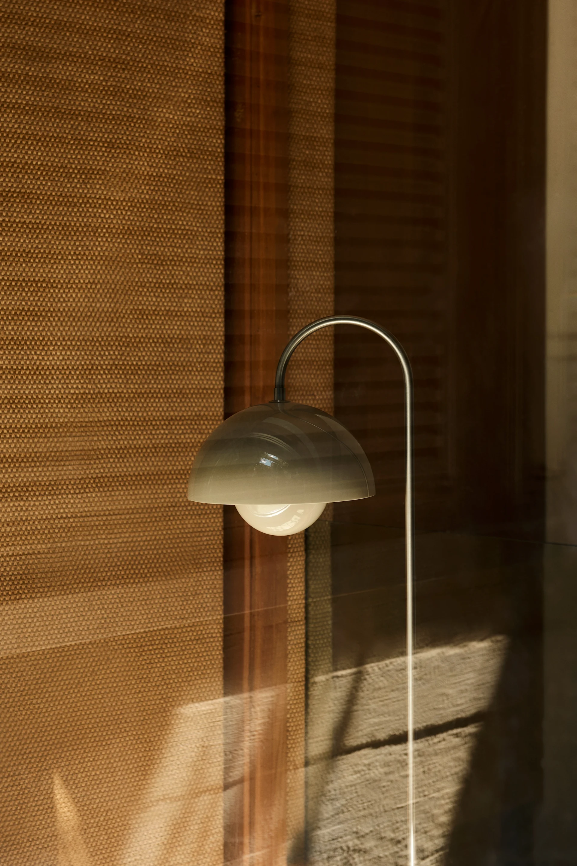 The VP12 floor lamp in beige, designed by Verne Panton for &Tradition.