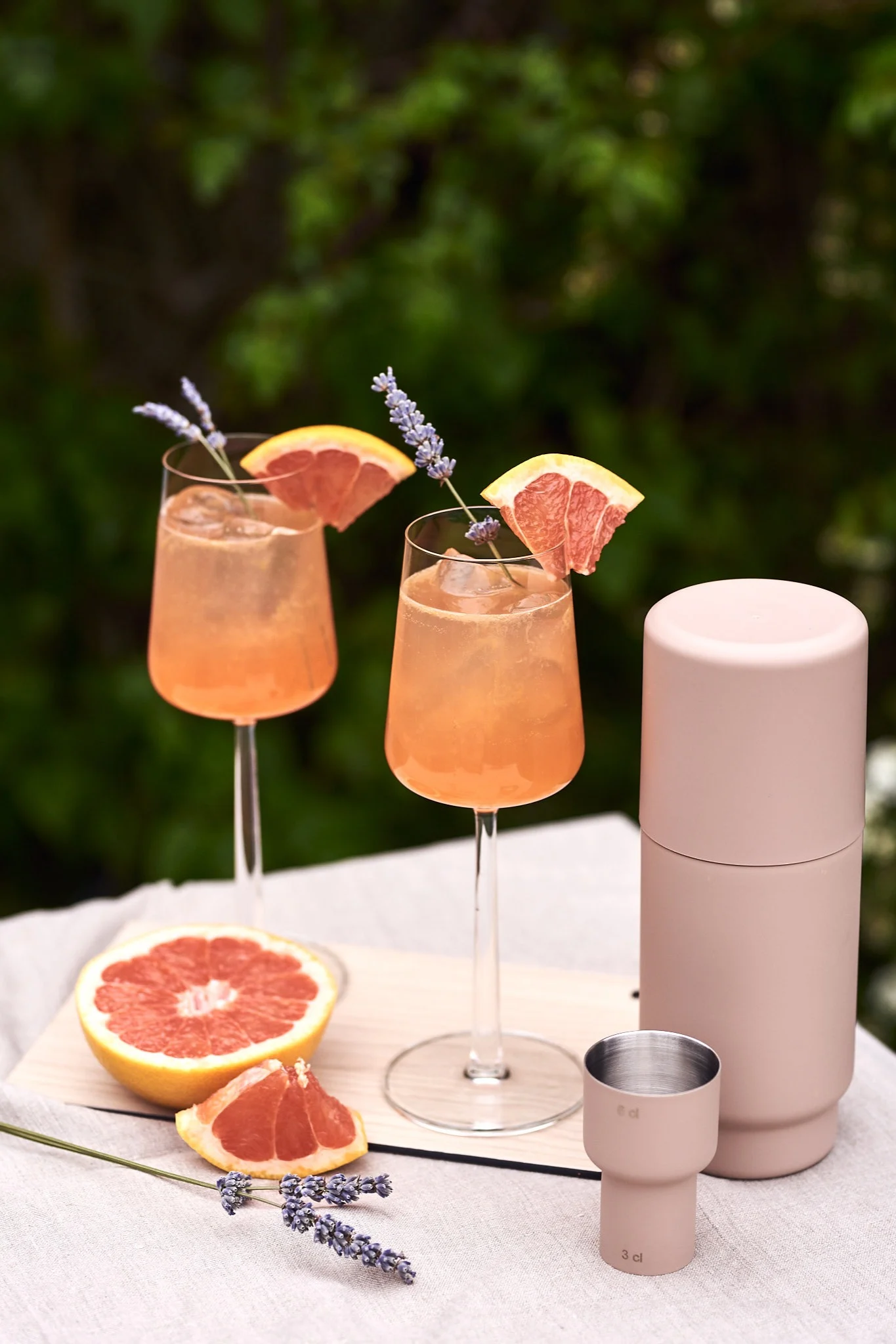 Grapefruit with a sprig of lavender is just one of several refreshing simple summer cocktails we are testing this summer - served here in the Essence white wine glass.